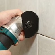 using oscillating tool to remove grout